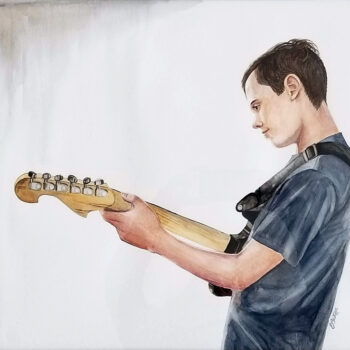 "The Guitar Player" is a watercolor figurative painting of a youth playing a guitar by artist Esther BeLer Wodrich